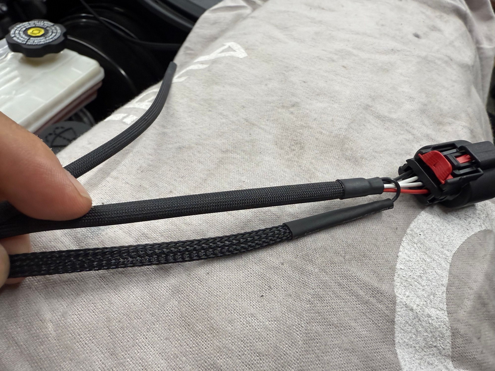 The loom i added to the small black wire needed to be ran to ecu 