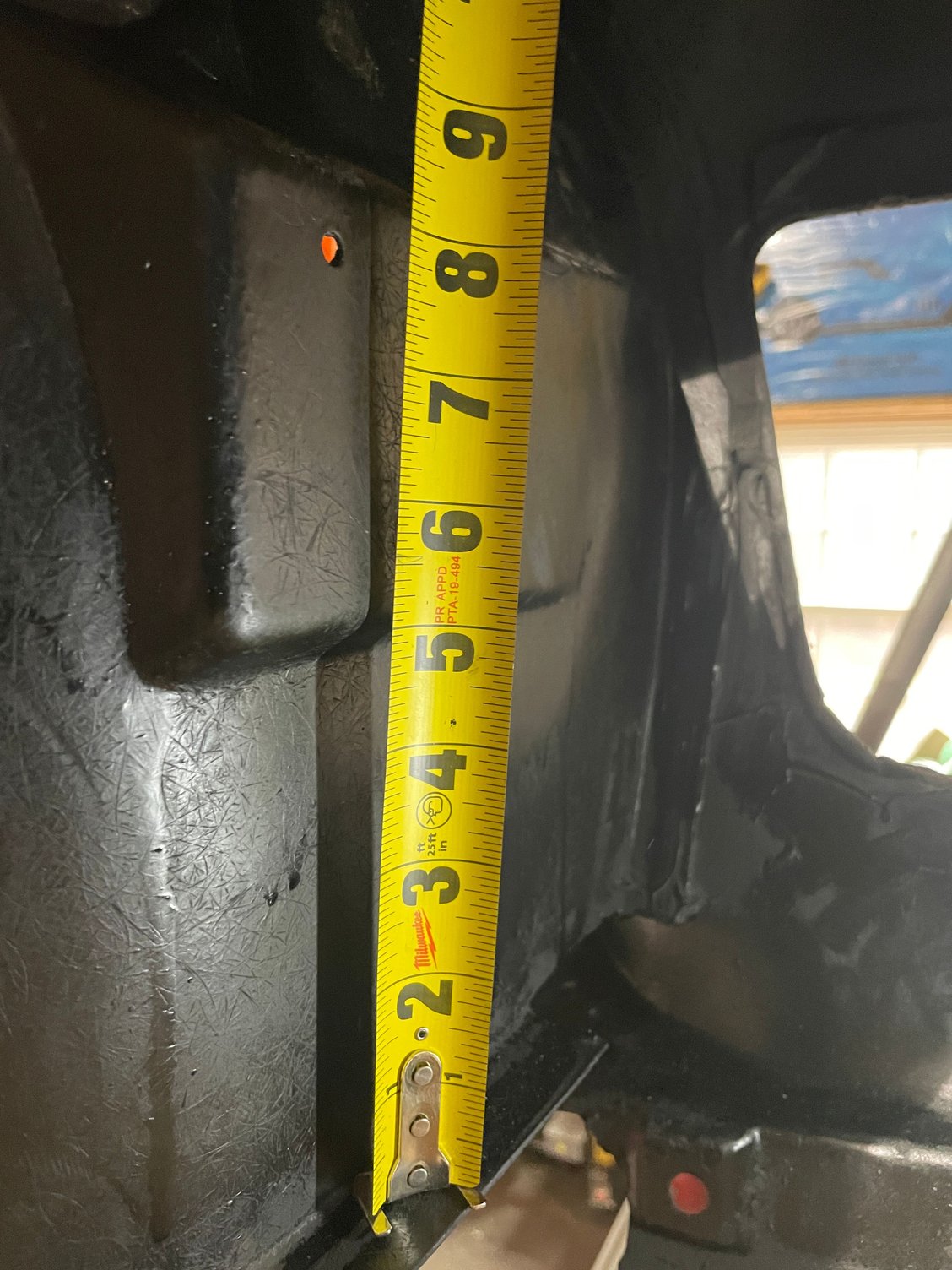 Vertical from lower fender lip