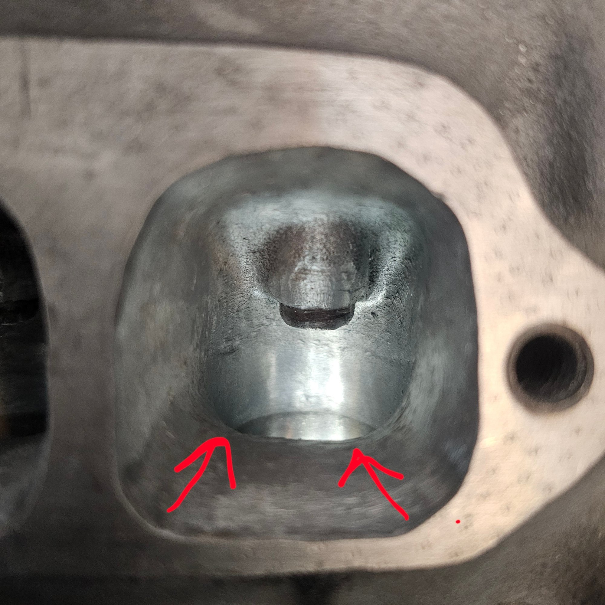 Pic 1: exhaust port is widest at the exit and gradually tapers inwards towards towards the bowl area as shown by the red arrows. Should i widen this taper and have a more consistent diameter from bowl to exit? 