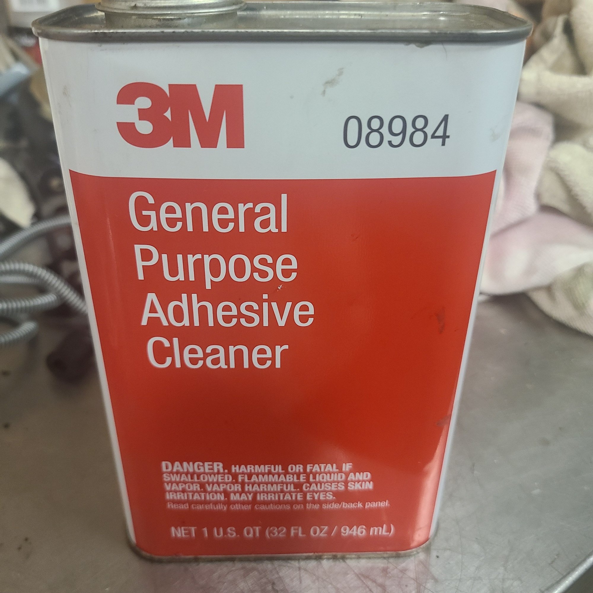 This stuff is the bomb if you can find it.  Hard to find and discontinued.  Cleans off any glue or residue on anything.  Mostly safe on your paint too.  Nothing else will work as well.