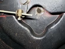 Underside of center hole showing the trim hold down tabs.