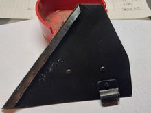 This shows the tab which fits in the weather stripping around the vent window