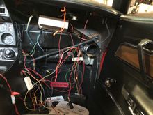 Plug the Convector into the radio, so you can find the screw holes, there is very little extra wire in the harness