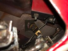 Getting ready to push the clip all the way over the key lock.  The position of the arm and little shaft on the key lock is critical 