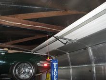 A fifth panel was added to the top of the 7 ft door to use 8 foot tracks gaining 16 inches of vertical height.