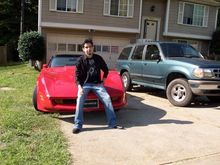 me sitting on the 1980 corvette classic with the regular Exploder next to her.