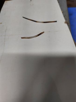 Metal slivers of unknown source. 