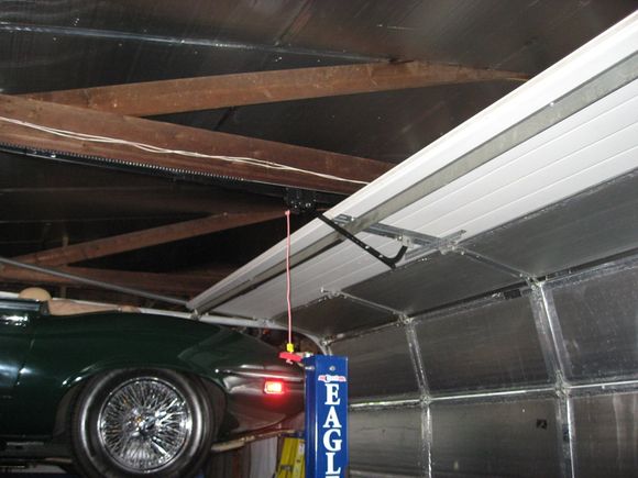 A fifth panel was added to the top of the 7 ft door to use 8 foot tracks gaining 16 inches of vertical height.
