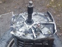 Spacer plate mounted to core transmission so grinding of face can take place, and the areas where the bolt heads rest are still the original height(needed to keep the bellhousing flush) and everything else on that side is below the bolt head locations.