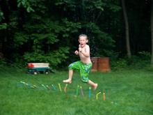 Chase playing in the sprinklers