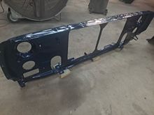 I finally got the core support to comply with this project, and it recieved the same treatment as the inner fenders.  1985 Mopar Navy Blue over black primer.