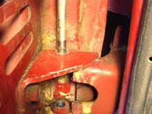 Upper hinge pin after driving it out with a long drift.