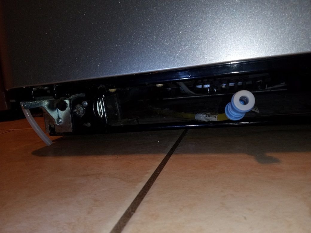 Water leaking from bottom of refrigerator when trying to use water