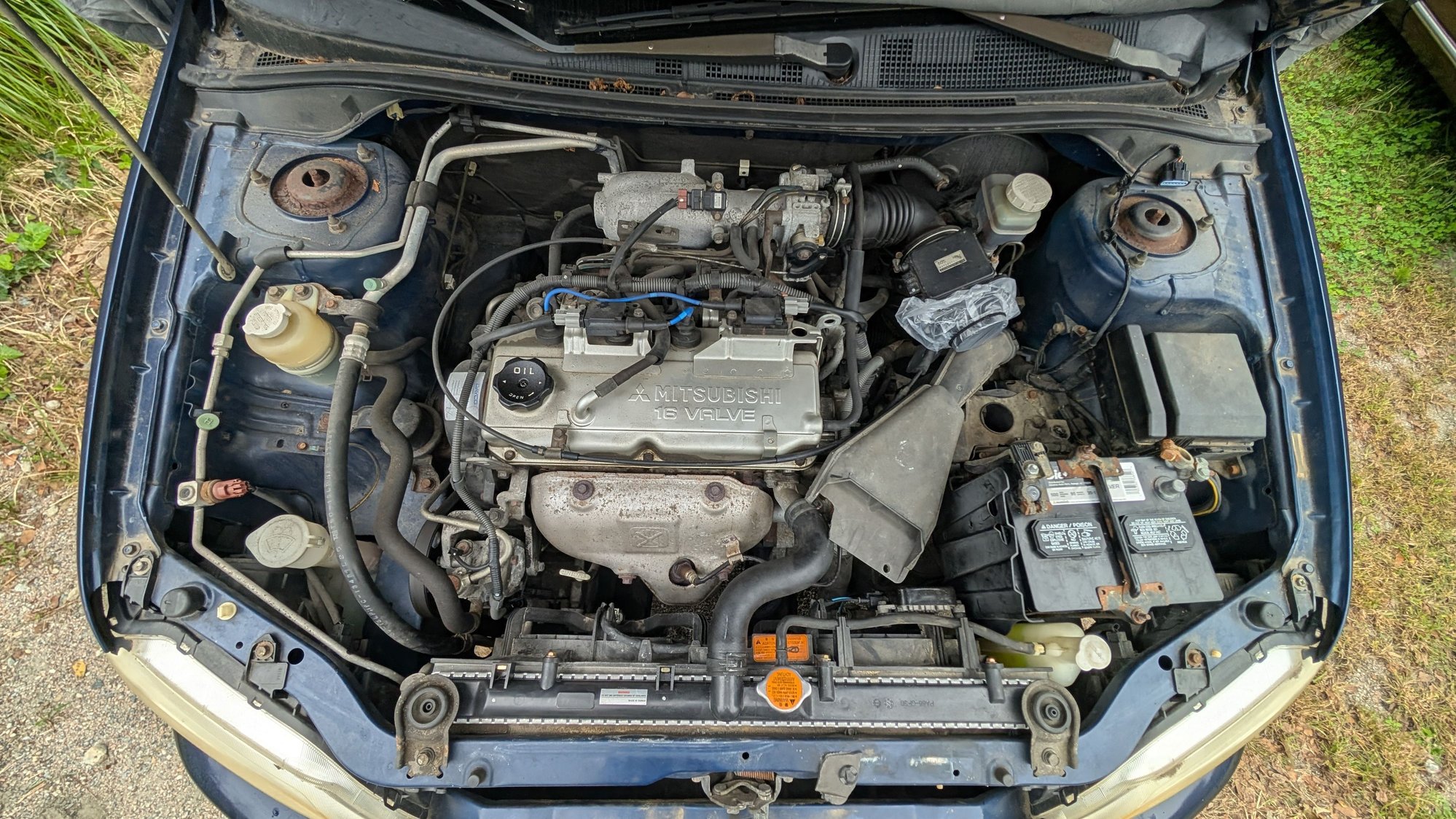 Stock engine bay, intake broke already replaced it with a titanium pipe elbow and an intake filter, the intake cleaner tube connected to the mass air flow sensor is too awkward to make it fit. Im open to ideas. I might have a shop that can put an aluminum tube or a rubber tube. 
