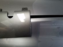 This is the tow hook cover for the JDM Evo 8/9 rear bumper.  I have not seen anyone post a picture of it against a graphite grey evo to show the difference in color.  This has been posted before, but I thought I would reiterate.  The diffuser portion of a jdm rear is not graphite grey, it is actually eisen grey mica (a02)