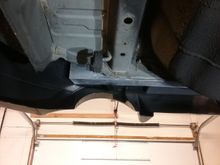 I need to build some sort of support bracket to take advantage of the factory push-pin location that holds the bottom up?  See the plastic hole?