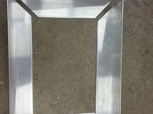 I measured carefully, and cut the edges at 45 degrees each.