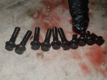 Shows the broken bolts against the good ones
