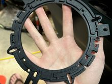 Mounting ring with three tabs that needed to be cut off