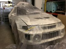 Last photo for now, featuring the extra parts on the racking in the background. This is currently how the car sits. Minus the Ganadors, sold them for stocks