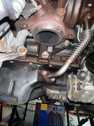 O2 housing bracket with bolt visible