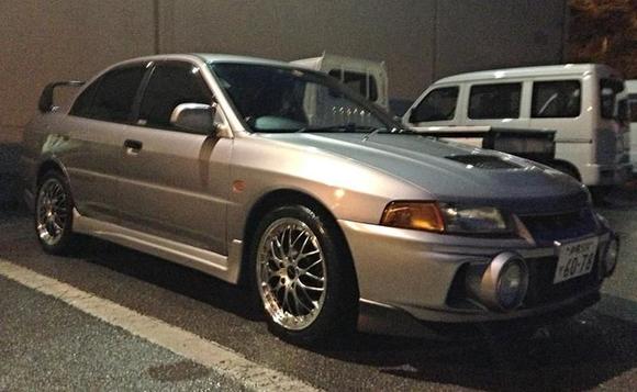 Sanded down the bumper lip and painted it silver black to match the trunk