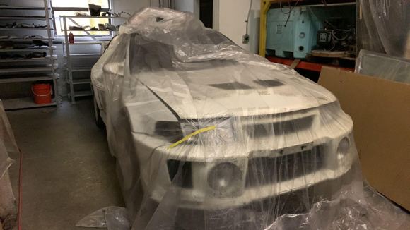 Last photo for now, featuring the extra parts on the racking in the background. This is currently how the car sits. Minus the Ganadors, sold them for stocks