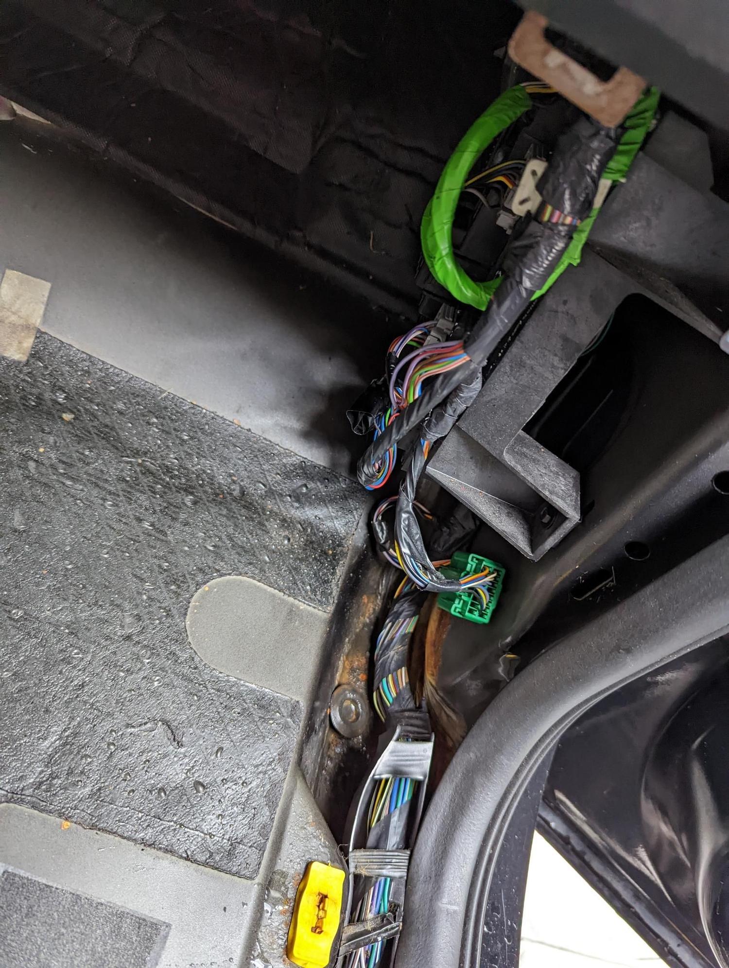 Water Leak behind passenger fuse box between firewall and fender Ford