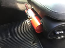 This is the front seat fire extinguisher mounted on the driver side. The front and back are both easy to get. I added a strap to make easy to release. Also the fire extinguisher moves with the seat. no interference from the front to the back.