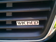 wicked badge installed close up