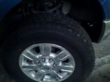 Hankook Dynapro ATm 275/70/18.  They are a little rough around town, but great on bumpy and rocky dirt roads and freezing rain/sleet.  Haven't tried them yet in mud or snow.