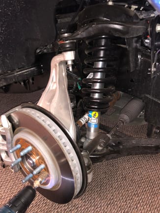 Front 5100 strut installed.  When I got it aligned the shop did not have to clearance anything to get the camber right as the drop was pretty minimal.