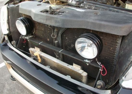 I wanted some brighter lights but didn't want to stick them to the outside. So I mounted some KCs behind the grill. Sturdy and they sure as hell don't jumble around when I'm off-road.