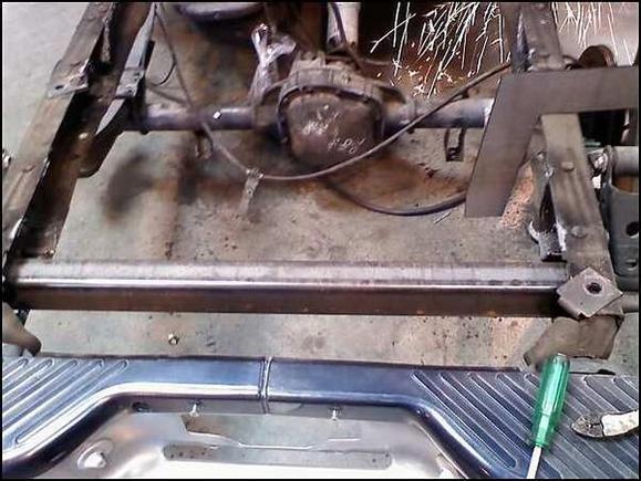 the spare tire and its mount used to go here. it was removed and a reinforcement bar was welded on.