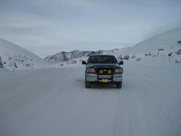 Atigun Pass on the Dalton Hwy, Alaska.  Highest pass in Alaska.  Most northern highway pass in the world.  North Slope and Prudue Bay beyond.