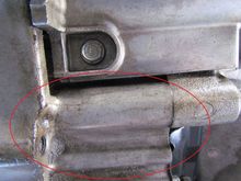 Do you see the thin layer of oil under my car. Is this also the area in which the "Rear Main Seal" is. I don't have a clue.