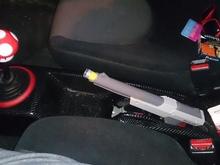 My custom made shifter and ebrake handle. The shifter knob weights almost 1/2 pound, shifts amazingly. The ebrake is a old zapper that I had and moddified to it to fit. And I must say this ebrake is the best mod I have done so far