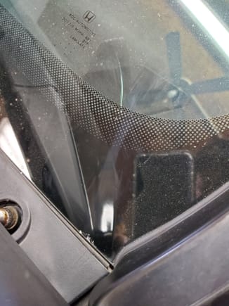 Here you can see how I used a screw driver to crack my winshield.  This piece that covers the wipers DOES NOT NEED TO BE REMOVED.  Ask me how I know...