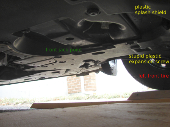 2016 Honda Fit: 3 Layers of 2x10" pine ramps = 4.5" height, enough to get underneath and do an oil change.