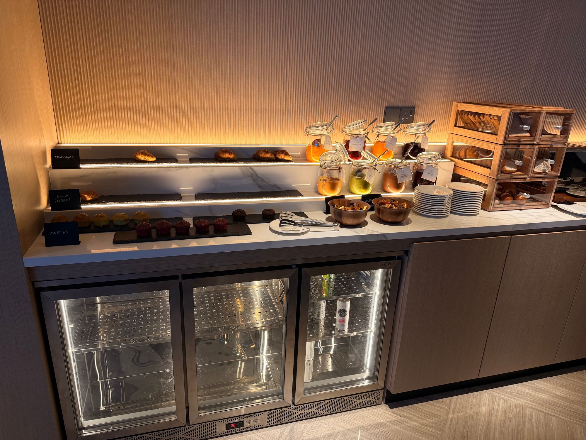 artful croissants over the denuded drink fridge
