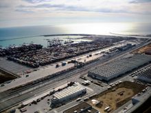 Almost on the ground, passing a container terminal