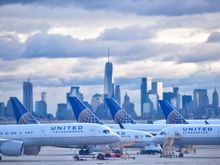 View of parked UA planes with NYC backdrop taken from Inside of plane at EWR