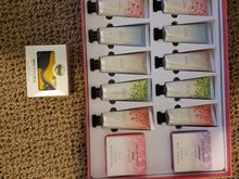 Here are my latest Secret Santa gifts. It's possible they are from two different Santa's-I don't know-there was no ID. One is a lovely hand mad bar scented with white tea and ginger and their other is 12 tubes of hand lotion in perfect traveling size in 6 different scents with 2 bars of soap. Big thanks for both-I love them both!! 