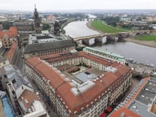 View of Hiton Dresden from dome of Frauenkirche. Entrance is glass dome arch. My room is the left corner of the hotel ( mid way up the picture. The hole in the middle of the hotel courtyard is the hot tub for the hotel pool ( hot tub is open air but accesed from the indoor pool