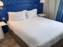 The room, with enough space on each side for a small stand, with power plugs on each side. 
