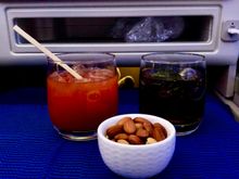 Bloody Mary and Coke with warm nuts.