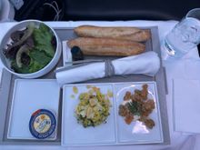 Pre-landing meal, shrimp with tangy cream sauce and black rice