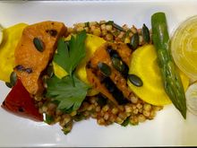 Tomato fregula with charred sweet potato, roasted pepper, asparagus, golden beetroot, quail’s egg, lemon dressing