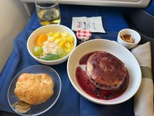 Pancakes, a little on the dry side but serviceable. Fruit/yogurt was fine; didn’t touch the “croissant.”