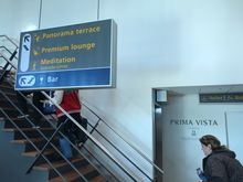 There is a staircase and elevator, you have to go to the upper level